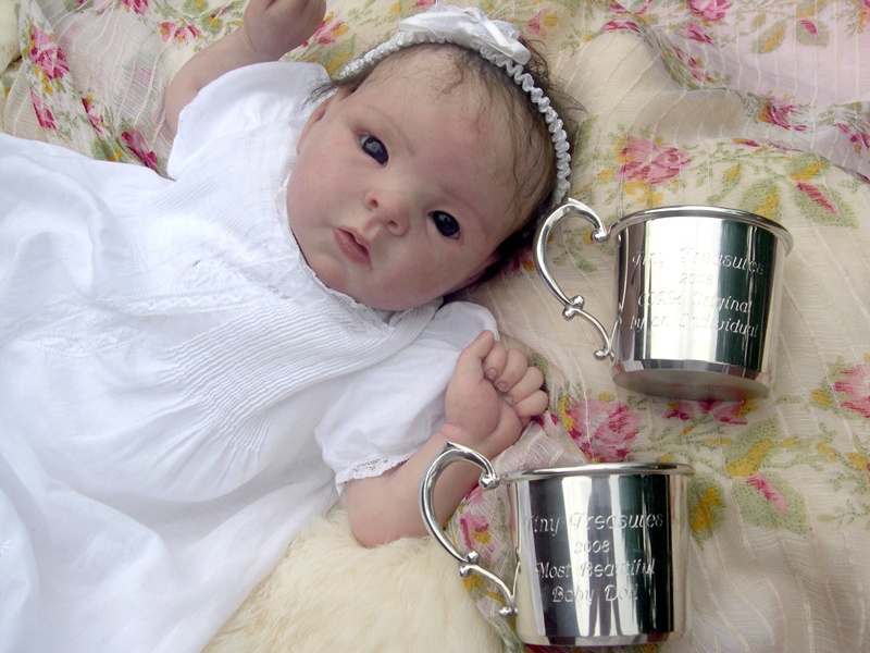 Baby Miya and her pewter award cups